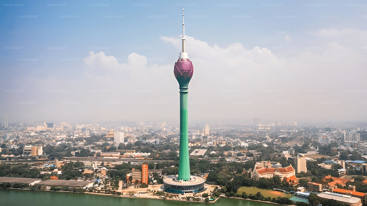 Tall green tower with a purple top in an urban setting