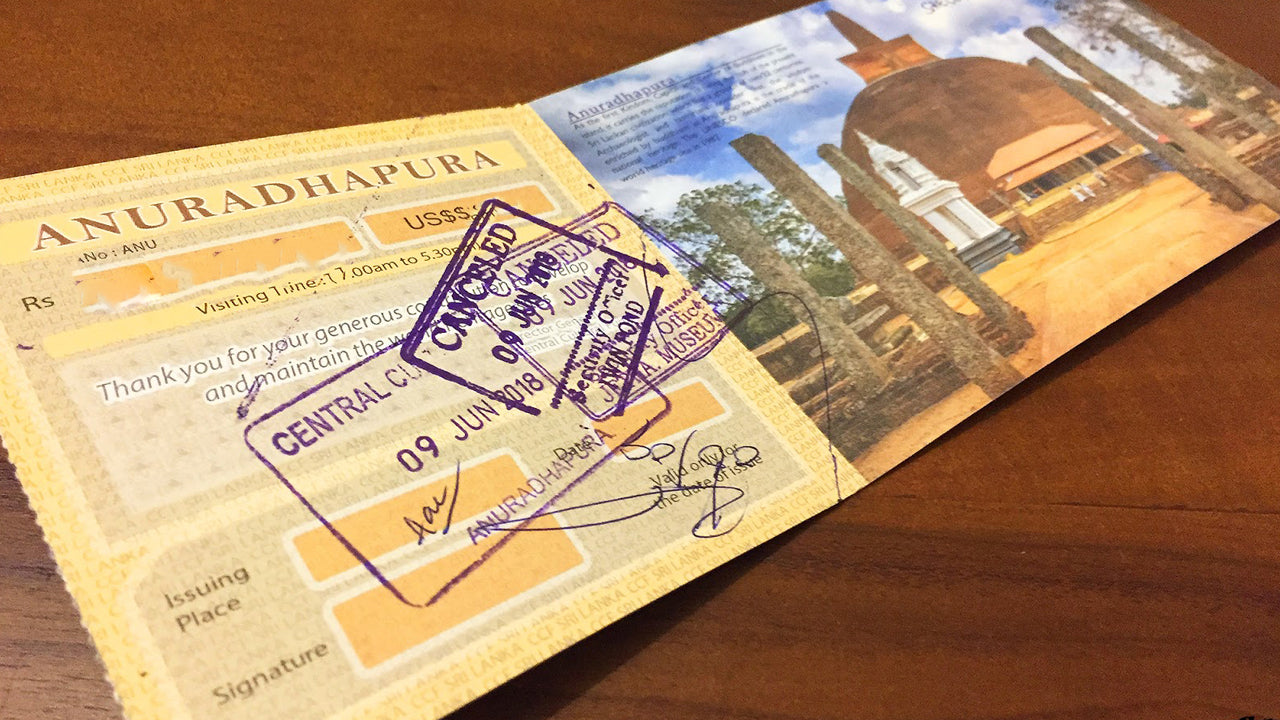 An entry ticket to Anuradhapura with a scenic view of a temple and a purple cancellation stamp.